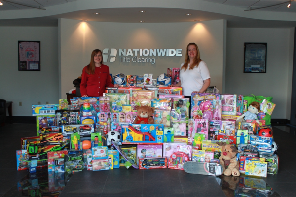 NTC's Joellen Raiti Vice President (left) and Erika Lance Senior Vice President (right) with over 200 toys donated to Toys for Tots®