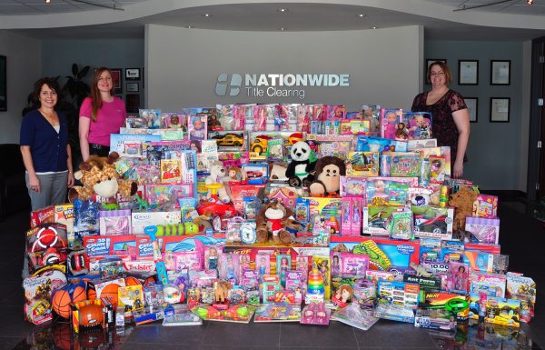 Nationwide Title Clearing Toys for Tots 2012 -From left, Janice Rush, Joellen Raiti and Erika Lance