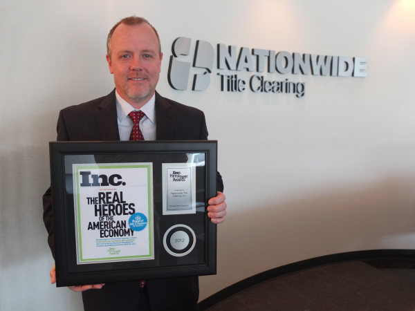 Nationwide Title Clearing CEO John Hillman with Inc. Hire Power Award 2012